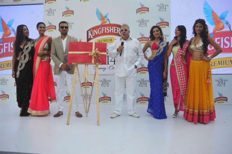 Chairman of UB Group Vijay Mallya with models during the launch of Kingfisher Calendar 2014 in Mumbai 