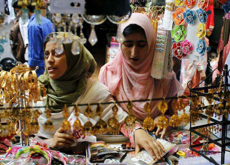 Kashmiri women busy shopping ahead of Eid ul-Fitr in Srinagar on July 27, 2014. (Photo: IANS)