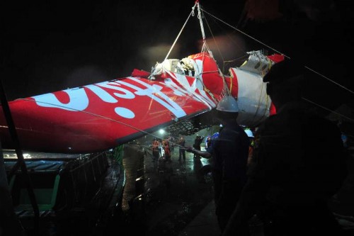 The tail part of crashed AirAsia flight QZ8501 is transferred from Crest Onyx ship in the port of Kumai, Pangkalan Bun, Indonesia, Jan. 11, 2015. 