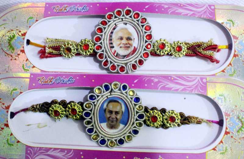 Rakhis with pictures of Prime Minister Narendra Modi and Odisha Chief Minister Naveen Patnaik on sale at a shop in Cuttack of Odisha 