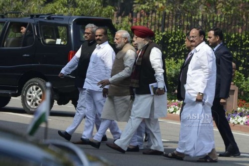 Prime Minister Narendra Modi, the Union Minister for Urban Development, Housing and Urban Poverty Alleviation and Parliamentary Affairs M. Venkaiah Naidu after attending a BJP parliamentary party meeting at the Parliament Library in New Delhi, on March 17, 2015.