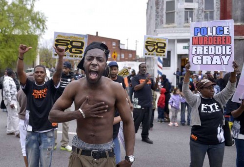 Residents celebrate in west Baltimore, Maryland, the United States, May 1, 2015. Maryland state prosecutor on Friday announced criminal charges against all six Baltimore police officers involved in the death of the 25-year-old black man Freddie Gray. 