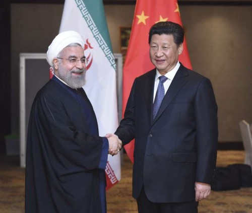 Chinese President Xi Jinping (R) meets with Iranian President Hassan Rouhani in Jakarta, capital of Indonesia, April 23, 2015.