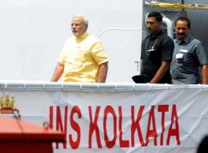 Prime Minister Narendra Modi with Admiral RK Dhowan, Chief of Naval Staff during the commissioning ceremony of INS Kolkata at the Naval Dockyard in Mumbai on August 16, 2014. (Photo: Sandeep Mahankal/IANS)