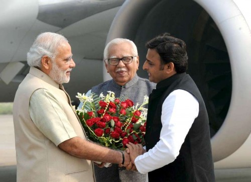 Prime Minister Narendra Modi being received by the Governor of Uttar Pradesh, Ram Naik and Uttar Pradesh Chief Minister Akhilesh Yadav, on his arrival at Varanasi airport on Nov 7, 2014. 