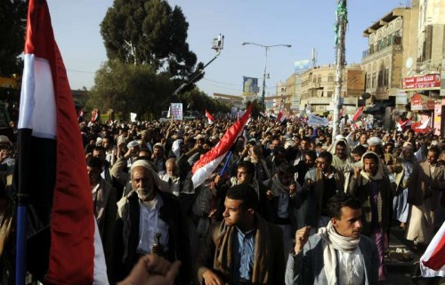 Yemeni people shout slogans during a rally marking the fourth anniversary of the 2011 revolution, in which former President Ali Abdullash Saleh was forced to step down, in Sanaa, Yemen, Feb. 11, 2015.