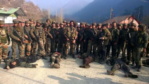  Soldiers present the bodies of the militants who mounted an audacious attack on Indian Army's Field Ordinance Camp at Mohra near the border town of Uri in Baramulla district of Jammu and Kashmir on Dec 5, 2014. 