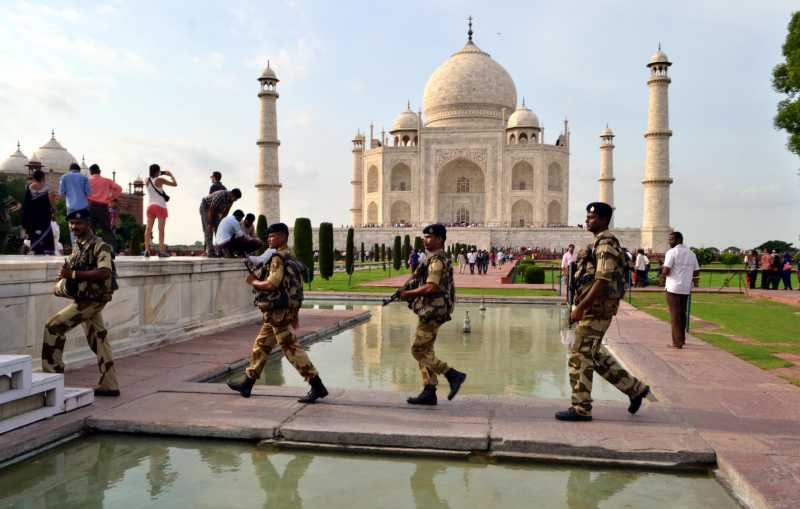 CISF personnel personnel patrol Taj Mahal in Agra on Aug 14, 2014. (Photo: Pawan Sharma/IANS)