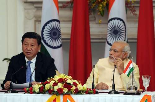 Prime Minister Narendra Modi with Chinese President Xi Jinping during a press conference at Hyderabad House in New Delhi 