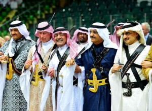 Saudi Arabia's second deputy Prime Minister Muqrin bin Abdulaziz (3rd L) and visiting Britain's Prince Charles (2nd L) perform traditional Saudi dance known as `Arda` during Janadriya Culture Festival in Riyadh on Feb.18, 2014. (Photo: Xinhua/IANS)