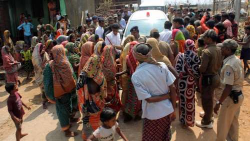 Villagers in cyclone hit Ganjam district of Odisha obstruct the path of Odisha Chief Minister Naveen Patnaik while he was visiting a village in the coastal district on Oct. 14, 2013.FILE PHOTO