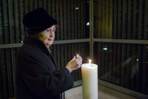 A woman holds a candle for her killed relatives before the memorial wall at the Holocaust Memorial Center in Budapest, capital of Hungary. On Jan. 27, 1945, Soviet troops liberated Auschwitz, the largest Nazi concentration camp in Poland where over one million people were killed. In 2005, The United Nations designated the same day as the international Holocaust Memorial Day in memory of the victims of the Holocaust. 