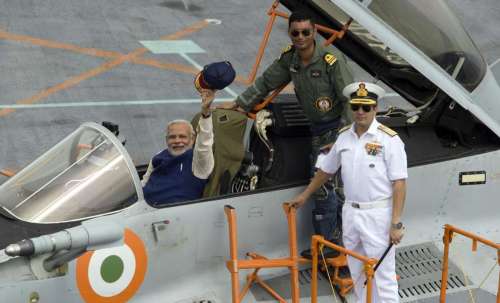 Prime Minister Narendra Modi in a fighter jet MIG 29K during the handing over of INS Vikramaditya to India Navy in Panaji. FILE PHOTO