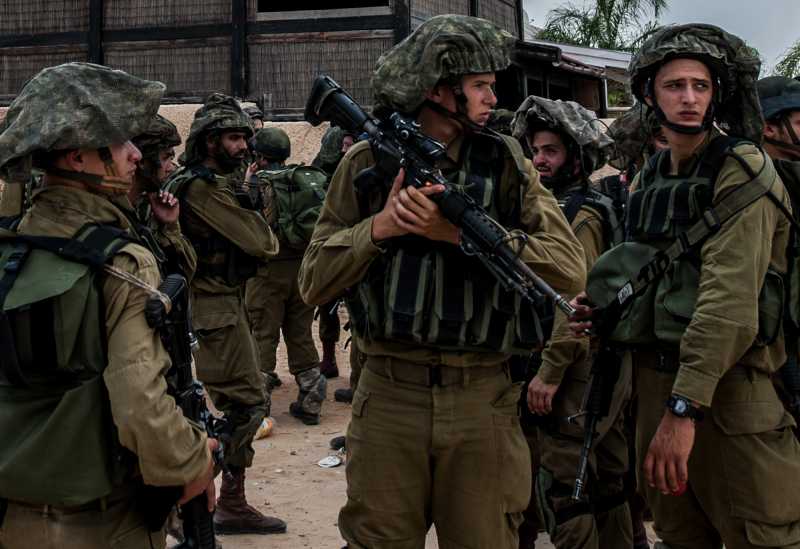 Israeli soldiers participate in a military operation in Sderot, south Israel bordering the Gaza Strip, on July 21, 2014, the 14th day of Israel's Operation Protective Edge against the Gaza Strip. Israel's large-scale military operations since July 8 has left 548 Palestinians dead and around 3,300 others wounded in the Palestinian enclave.