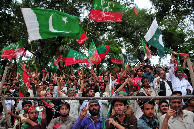 -- Supporters of Pakistani political leader Imran Khan wave flags as they take part in a protest against the country's ruling Pakistan Muslim League-Nawaz in Islamabad, capital of Pakistan on Aug. 16, 2014. Senior Pakistani political leader Imran Khan on Saturday demanded Prime Minister Nawaz Sharif resign and new elections be held as last year's polls were rigged. (Xinhua/Ahmad Kamal)