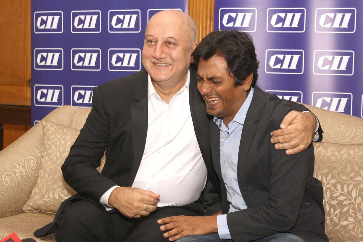 New Delhi: Actors Anupam Kher and Nawazuddin Siddique during the Service Conclave 2014, organized by CII, in New Delhi on Nov 12, 2014. (Photo: Amlan Paliwal/IANS)