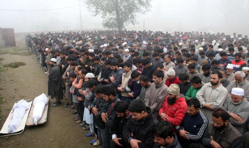 Chattergam: People in large numbers participate in the funeral of the two local youths who were killed in army firing, in Chattergam village of Jammu and Kashmir's Badgam district on Nov.4, 2014. 