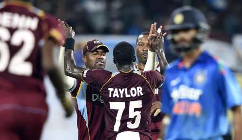 West Indians celebrate after fall of wicket during the first ODI match between India and West Indies at Jawaharlal Nehru Stadium in Kochi