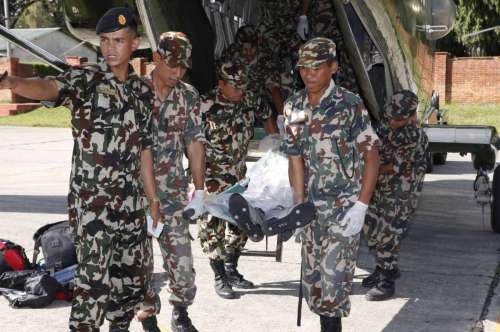  Nepalese Army personnel bring the bodies of avalanche victims in Kathmandu, Nepal, Oct. 17, 2014. The death toll from snow blizzards in northern Nepal will probably climb to 50 as more than 100 people are still missing, Trekking Agencies Association of Nepal