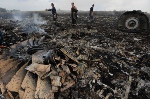 The debris at the crash site of a passenger plane near the village of Grabovo, Ukraine. A Malaysian flight crashed Thursday in eastern Ukraine near the Russian border, with all the 280 passengers and 15 crew members on board reportedly having been killed.