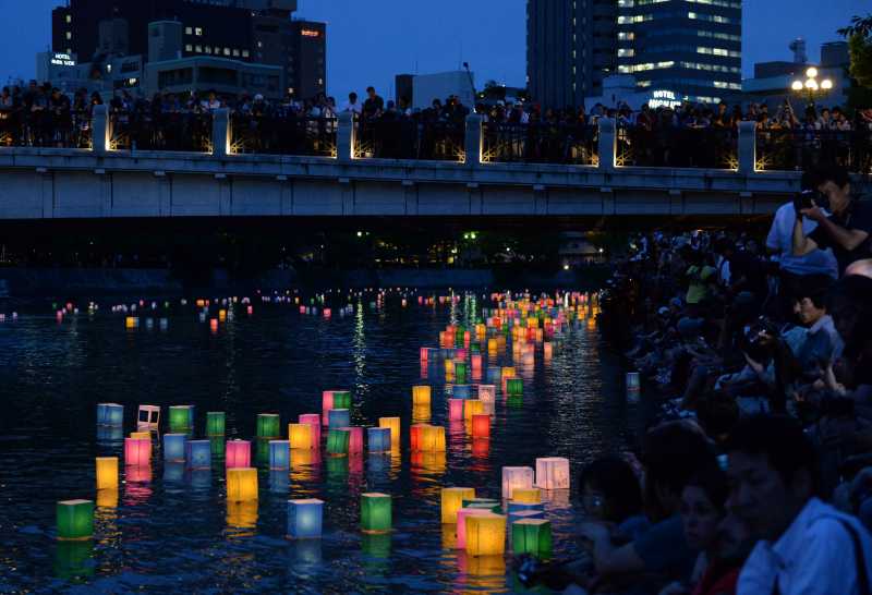 Paper lanterns float along the Motoyasu River in front of the Atomic Bomb Dome in Hiroshima, western Japan