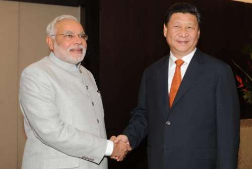 Prime Minister Narendra Modi during a meeting with President of the People's Republic of China Xi Jinping on the sidelines of 6th BRICS Summit in Fortaliza, Brazil on July 14, 2014. Modi called for amicably resolving the boundary row with China and sought enhanced investment in India's infrastructure sector during the meeting. (Photo: IANS)