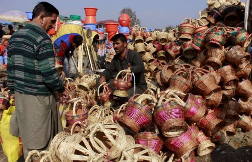 People buy `kangris` in a Srinagar market before winters. Kangri consists of decoratively crafted case made of wicker which is woven around an earthen pot and is used in Kashmir to keep one warm during winters.