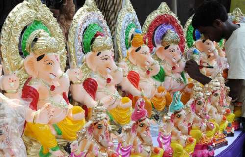 An artist gives final touches to Ganesha idols in Chaturthi in Amritsar 