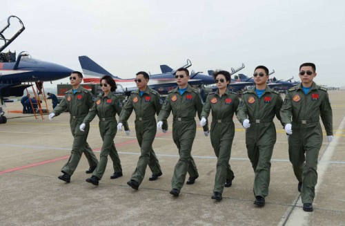 Members of China's Bayi Aerobatic Team, is seen with J-10 jet fighters on the runway at the 10th China International Aviation and Aerospace Exhibition in Zhuhai, south China's Guangdong Province, Nov. 11, 2014. This Tuesday marks the 65th anniversary of the establishment of the Air Force of the Chinese People's Liberation Army 