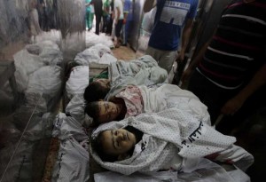  The bodies of children at the morgue of the al-Shifa hospital in Gaza City. The 13-day Israeli military operation on the Hamas-rued territory has so far claimed the lives of at least 390. More than 3,000 others have been injured.