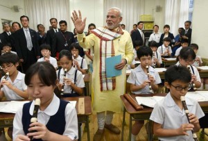 Prime Minister Narendra Modi interacts with children during his visit to Taimei Elementary School, in Tokyo, Japan on Sept 1, 2014. (Photo: IANS/PIB)