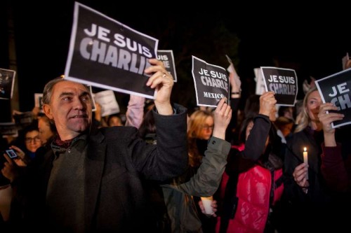 People take part in a protest against the attack on French satirical weekly "Charlie Hebdo" in Paris, in front of the French Ambassy in Mexico City, capital of Mexico, on Jan. 8, 2015.