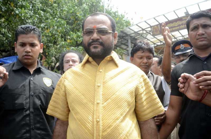 Pankaj Parakh, a Nashik based businessman wearing a shirt made-up of 4 kg pure gold costing Rs 1 .30 crore during his visit to Siddhivinayak Temple in Mumbai on Aug 5, 2014. (Photo: Sandeep Mahankal/IANS)