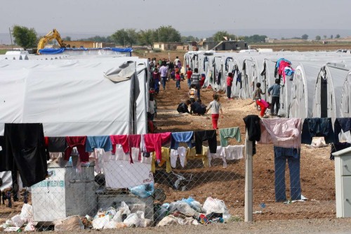 Syrian Kurdish refugees are seen the Turkish-Syrian border in Sanliurfa province, Turkey