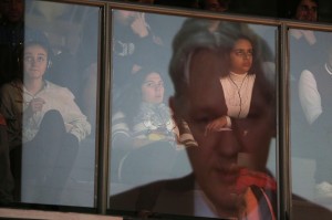 Residents attend a videoconference in which participates Julian Assange, founder and spokesman of WikiLeaks, from the Ecuador's embassy in London, in the framework of the "Freedom, privacy and the future of Internet" seminar, in Sao Paulo, Brazil