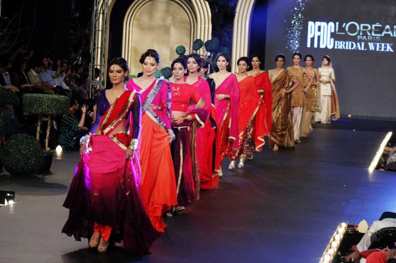 Models present creations by designer Sadaf Malaterre on the second day of the Pakistan Fashion Design Council (PFDC)'s Bridal Week in eastern Pakistan's Lahore 