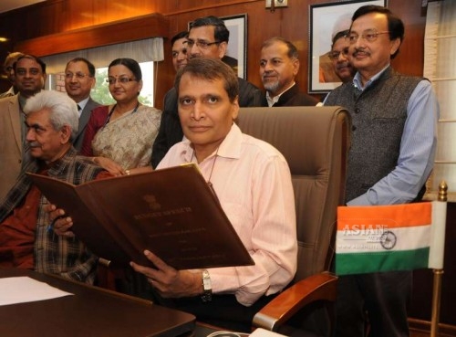 The Union Minister for Railways Suresh Prabhakar Prabhu gives finishing touches to the Railway Budget 2015-16, in New Delhi on Feb 25, 2015. Also seen the Union Minister of State for Railways Manoj Sinha and others.