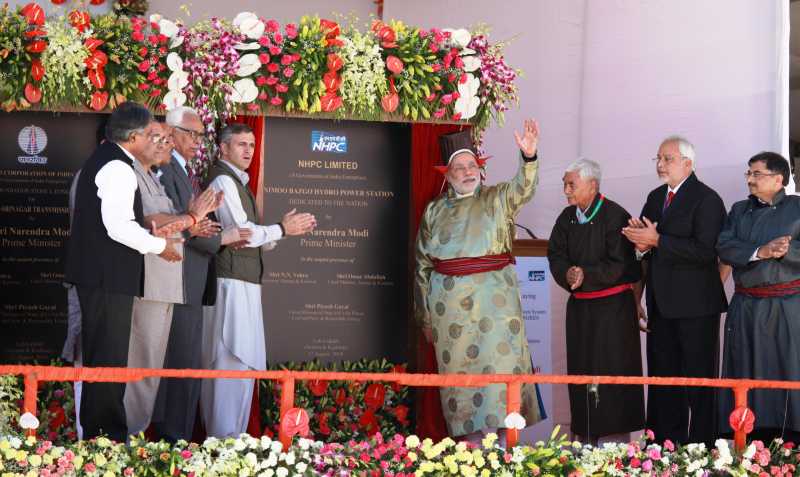 Prime Minister Narendra Modi, dressed in traditional Ladakhi gown and headgear with Jammu and Kashmir Chief Minister Omar Abdullah during inauguration of 45 megawatt Nimoo-Bazgo hydro-electric project in Leh