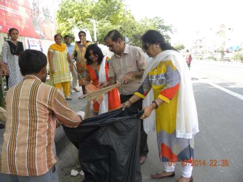 Delhi Tourism department officials participate in `Swacch Bharat Mission` - a nationwide campaign that aims to clean up India in five years - in New Delhi