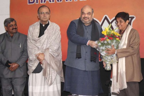  Social activist and former IPS officer Kiran Bedi joins BJP in presence of (L-R) Delhi BJP Chief Satish Upadhyay, Union Minister for Finance, Corporate Affairs, and Information and Broadcasting Arun Jaitley, BJP chief Amit Shah in New Delhi, on Jan 15, 2015.