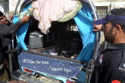 Pakistani policemen inspect a van after an attack on polio health workers in southwestern Pakistan's Quetta on Nov. 26, 2014. At least four polio workers were killed and three others were injured when gunmen open fire on a polio team in Quetta on Wednesday morning, local media reported. 