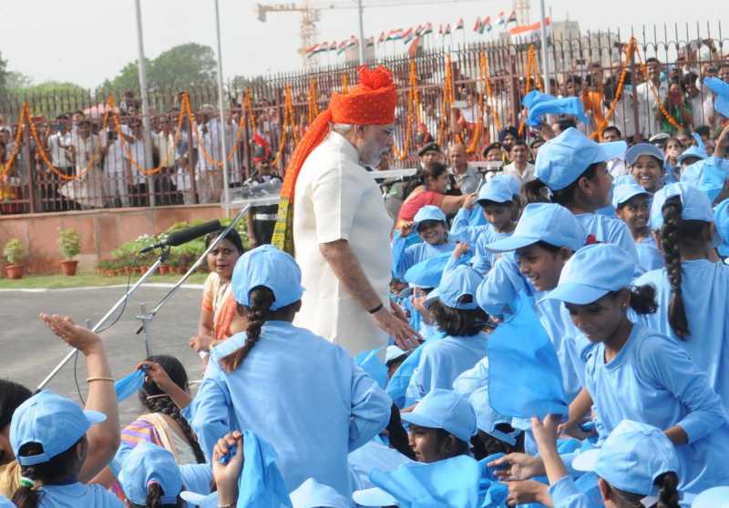 Prime Minister Narendra Modi interacts with children after addressing the nation on the occasion of 68th Independence Day from the ramparts of Red Fort, in Delhi 