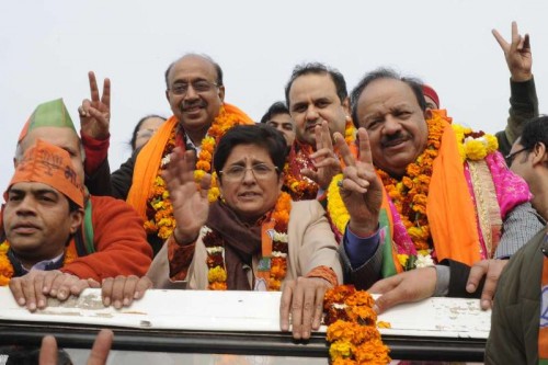  BJP leader Kiran Bedi with party leader Vijay Goel, Union Minister for Science & Technology and Earth Sciences Dr. Harsh Vardhan and others proceeds to file her nomination papers for upcoming Delhi assembly polls at Krishna Nagar, Delhi on Jan 21, 2015. 