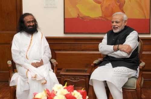 Spiritual leader Sri Sri Ravi Shankar calls on the Prime Minister Narendra Modi, in New Delhi on March 3, 2015.