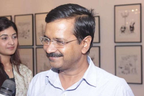 New Delhi: Aam Aadmi Party (AAP) Arvind Kejriwal at an art exhibition showcasing cartoonist Sudhir Tailang's creations at India Habitat Centre, in New Delhi on Nov.2, 2014. FILE PHOTO