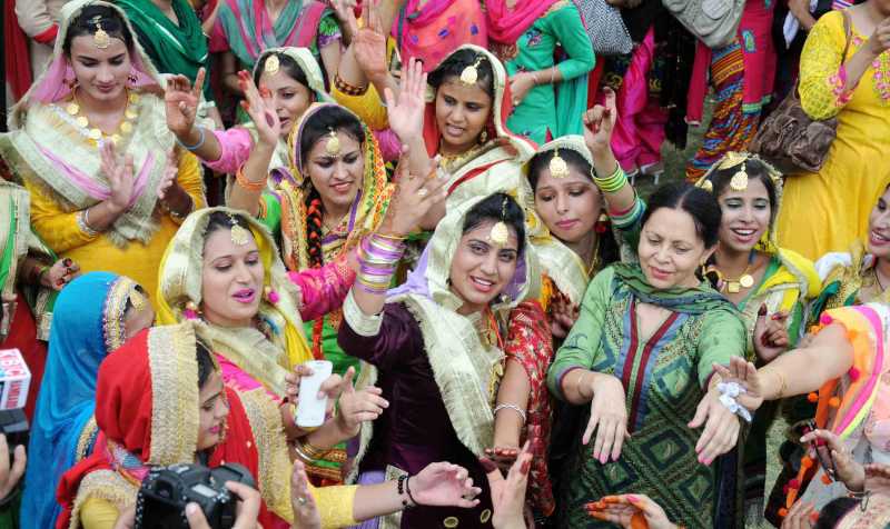 Girls celebrate Teej festival in Amritsar on August 2, 2014. (Photo: IANS)