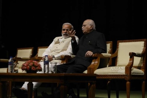  Prime Minister Narendra Modi with BJP MP from Gandhinagar L K Advani at the Parliament ahead of the budget session of the house in New Delhi