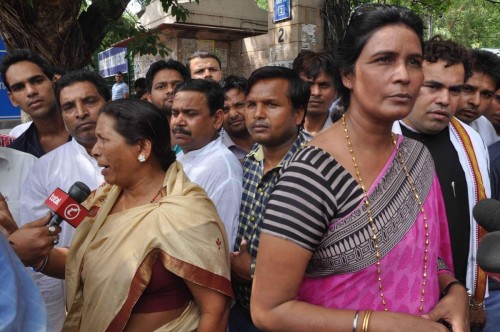 Rukmini Devi Nishad (left), sister of bandit-turned-politician Phoolan Devi and Shikha Singh (right) sister of Sher Singh Rana, the lone convict in the murder of the politician talk to media after a Delhi court awarded life imprisonment to Rana, in New Delhi on Aug 14, 2014.FILE PHOTO