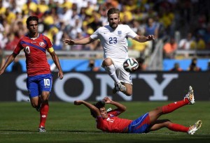 England's Luke Shaw (up) vies with Costa Rica's Yeltsin Tejeda (bottom) during a Group D match between Costa Rica and England of 2014 FIFA World Cup at the Estadio Mineirao Stadium in Belo Horizonte, Brazil