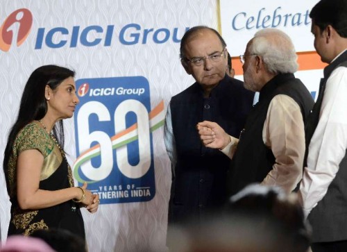 Prime Minister Narendra Modi with  Arun Jaitley  during a programme organised to celebrate 60th anniversary of ICICI Bank in Mumbai, on Jan 2, 2015. (Photo: Sandeep Mahankal/IANS)